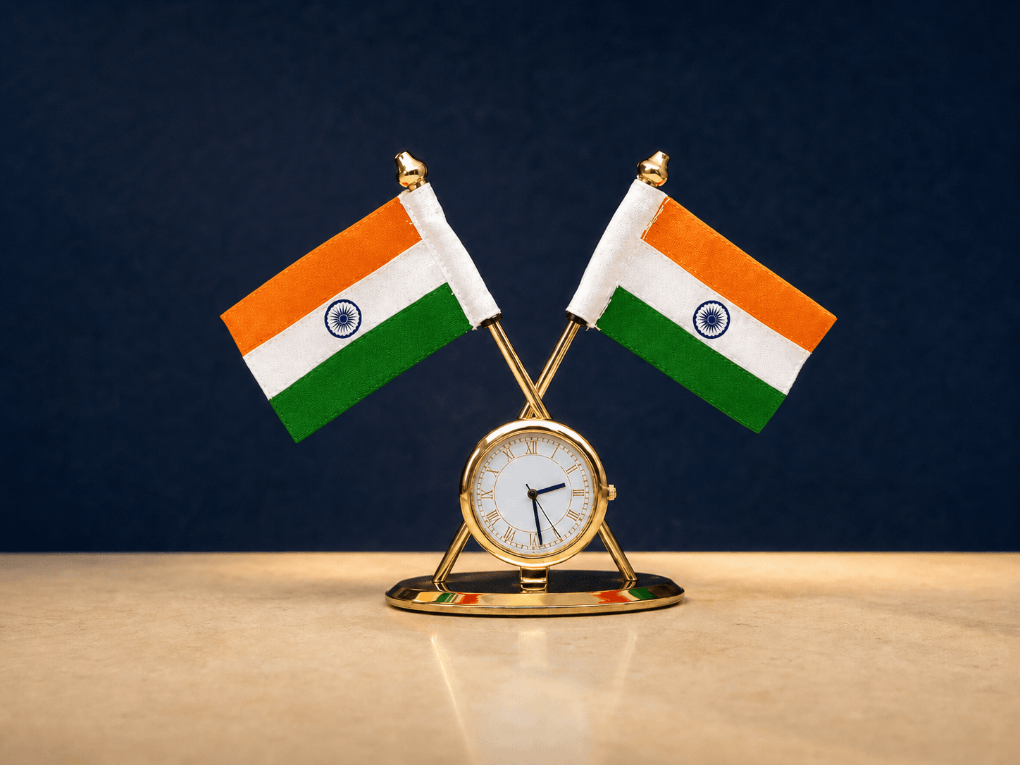 Two Indian desk flags crossed above a gold clock on an indigo heritage backdrop